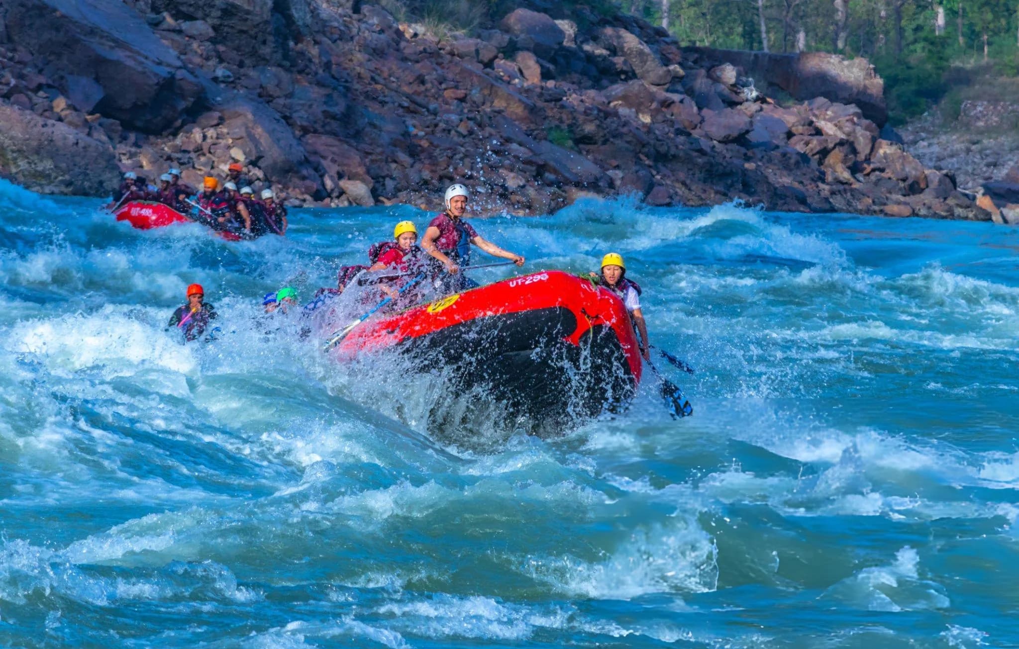 Rafters paddling through white-water rapids on the Ganga in Rishikesh